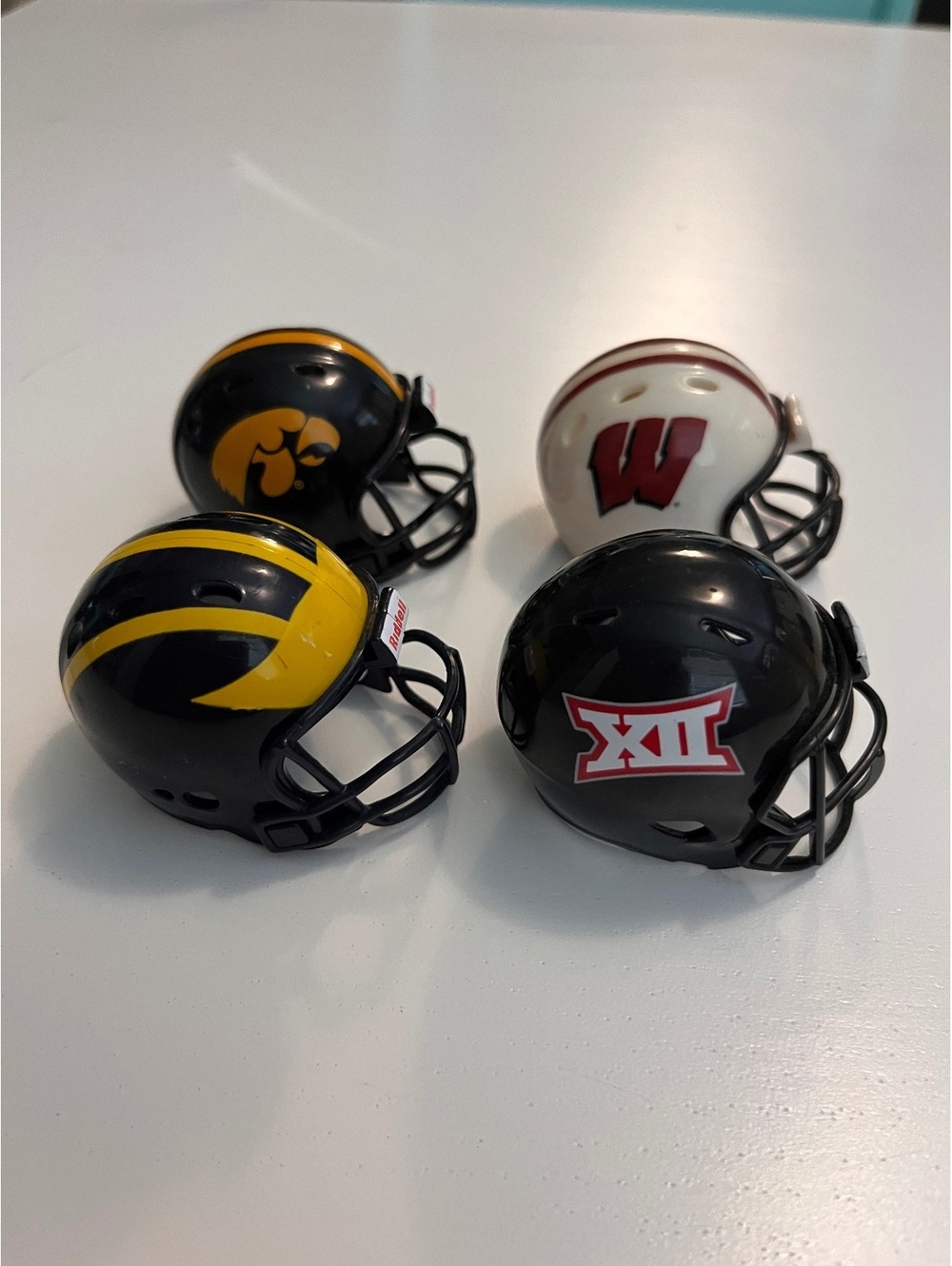 Riddell Mini Pocket Football Helmets Set of 4 - Big Ten Michigan Iowa Wisconsin